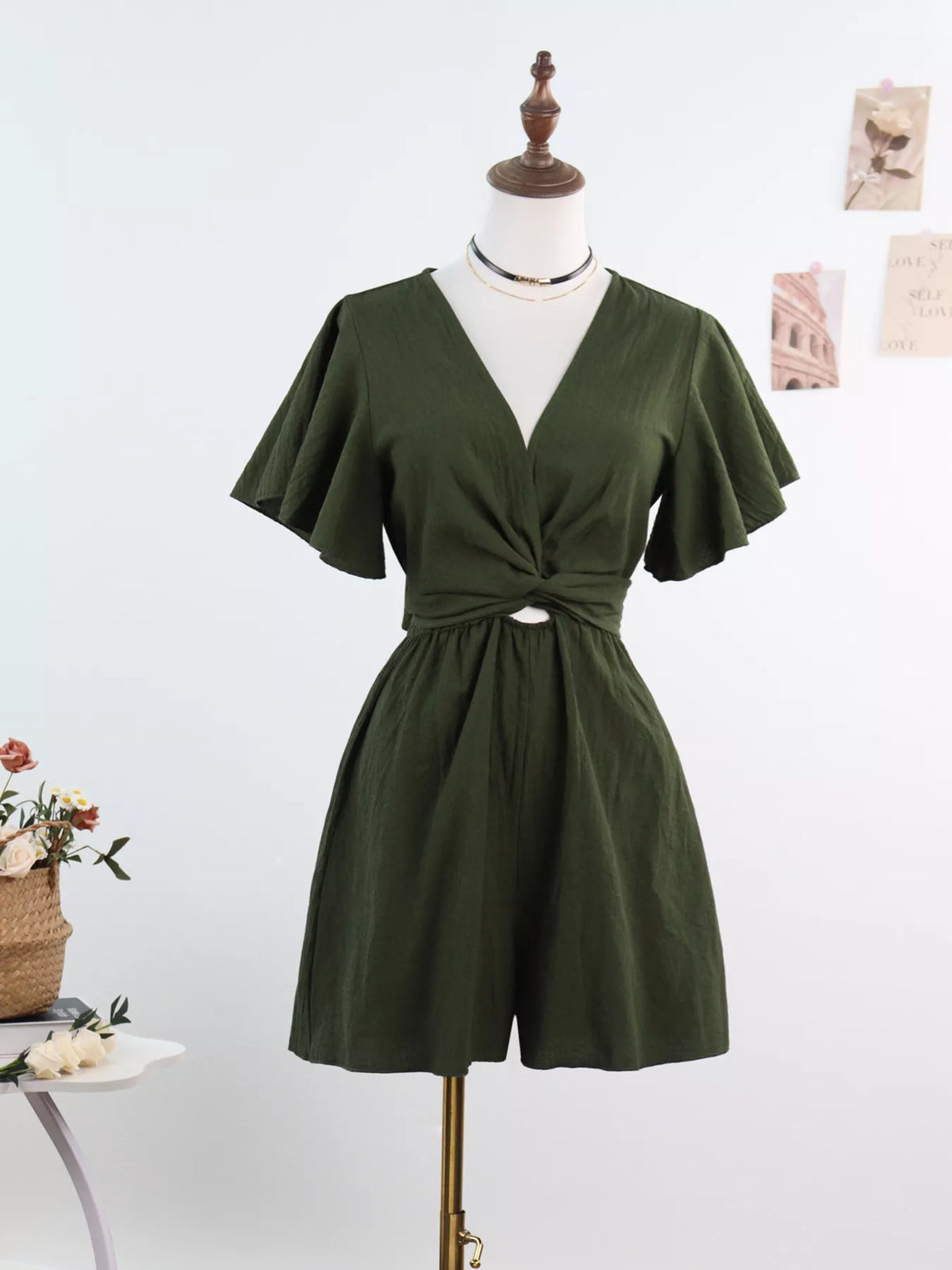 Olive flutter-sleeve romper on mannequin, front