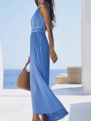 Side view of model wearing sky-blue sleeveless pleated maxi dress