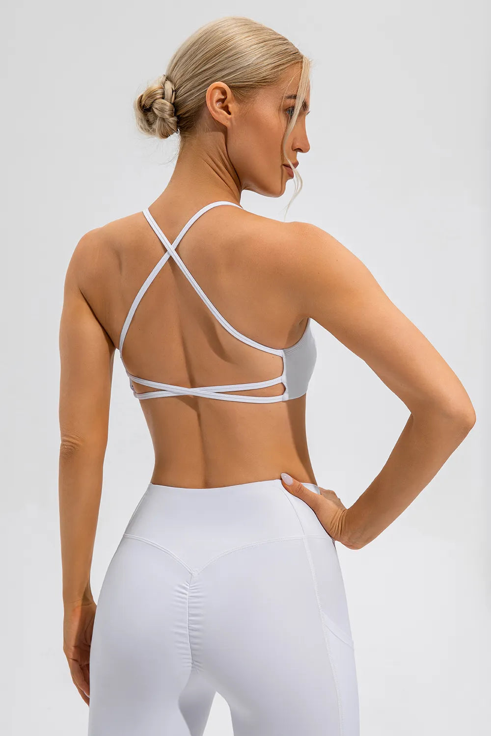 White cami and leggings, model turned to the side
