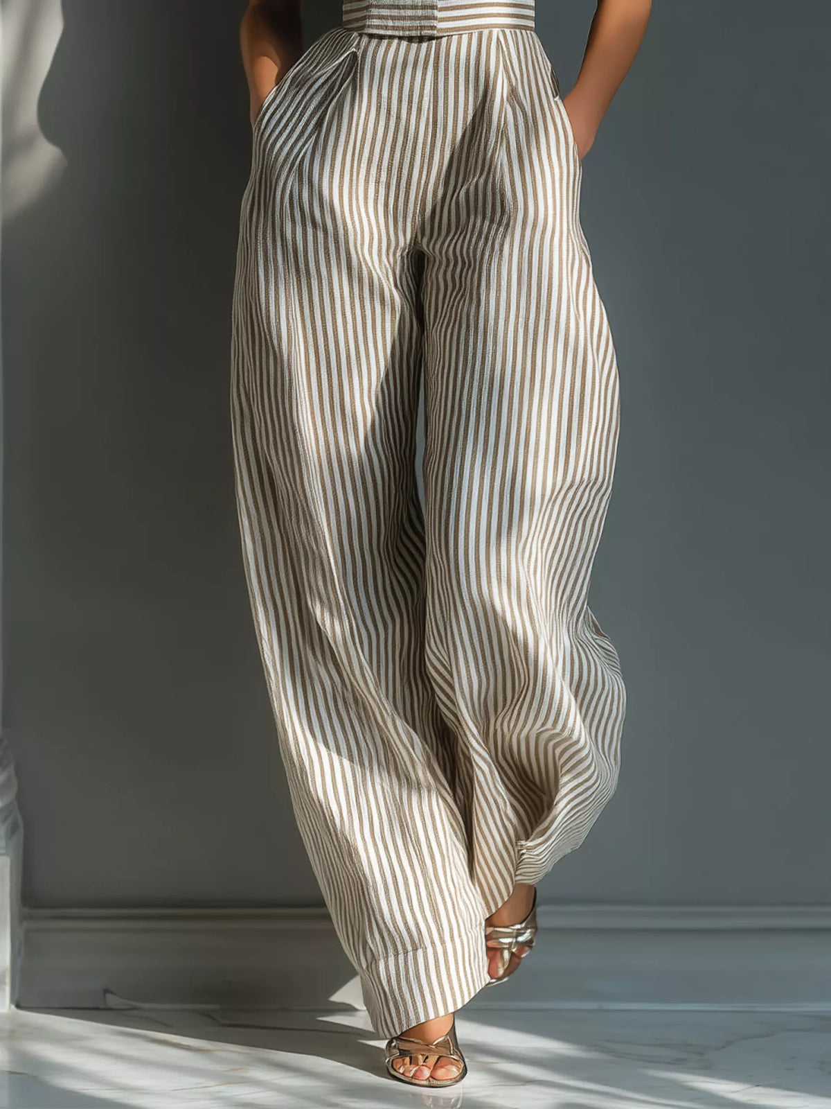 Close view of the vertical stripes and wide-leg cut of the jumpsuit.