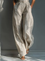Close view of the vertical stripes and wide-leg cut of the jumpsuit.