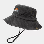 Black bucket hat with orange sunset and white mountain embroidery, front view
