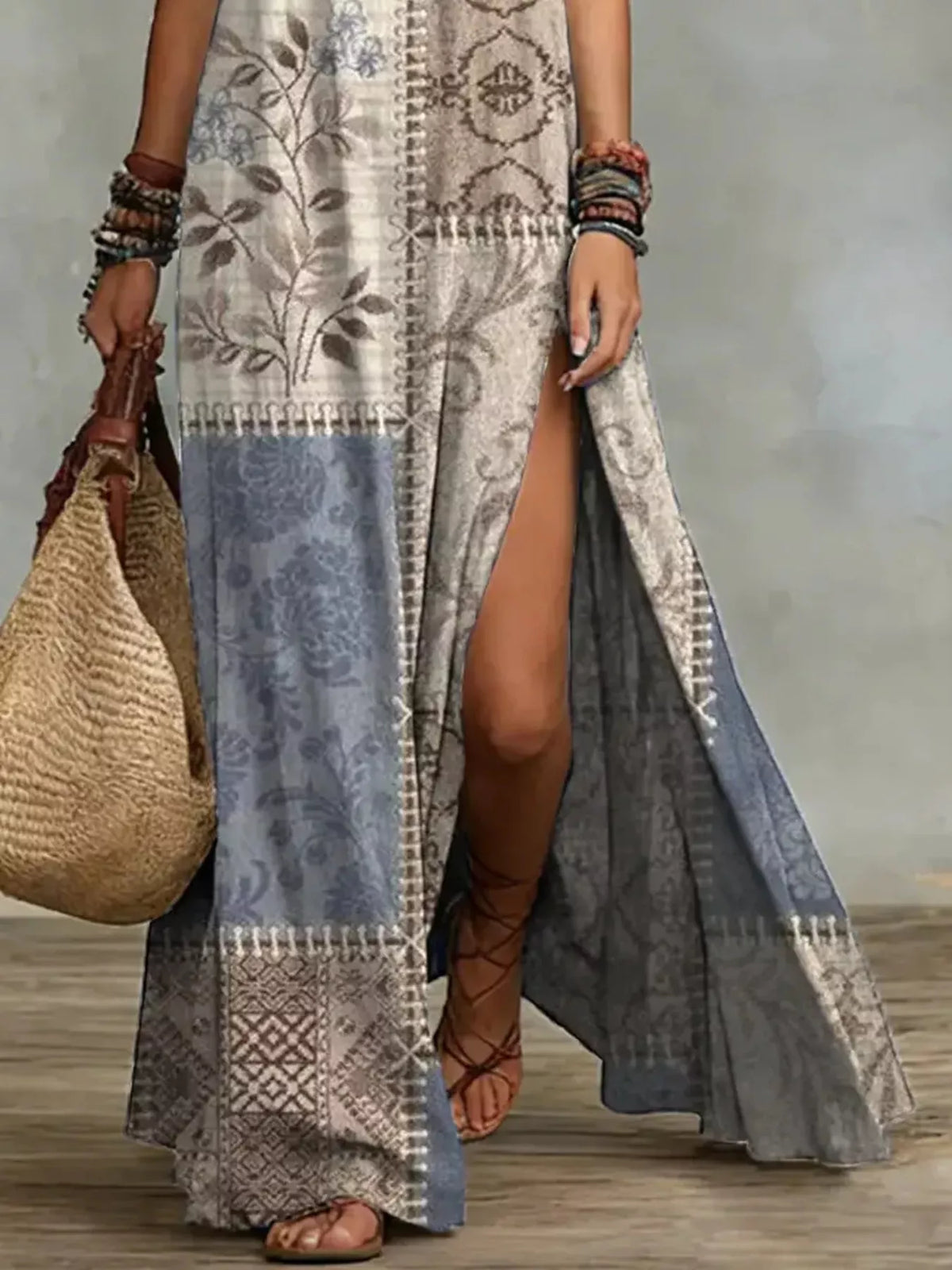 Close view of printed maxi dress showing side slit and contrasting sheer panel