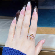 Open dark jewelry presentation box with a light-colored lid