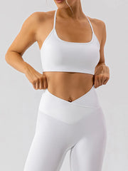 Angled front view of white active bra with matching leggings