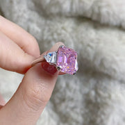 Close side view of the blush pink rectangular zircon and raised setting