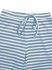 Detail of ribbed blue-and-white striped fabric and pant waistband