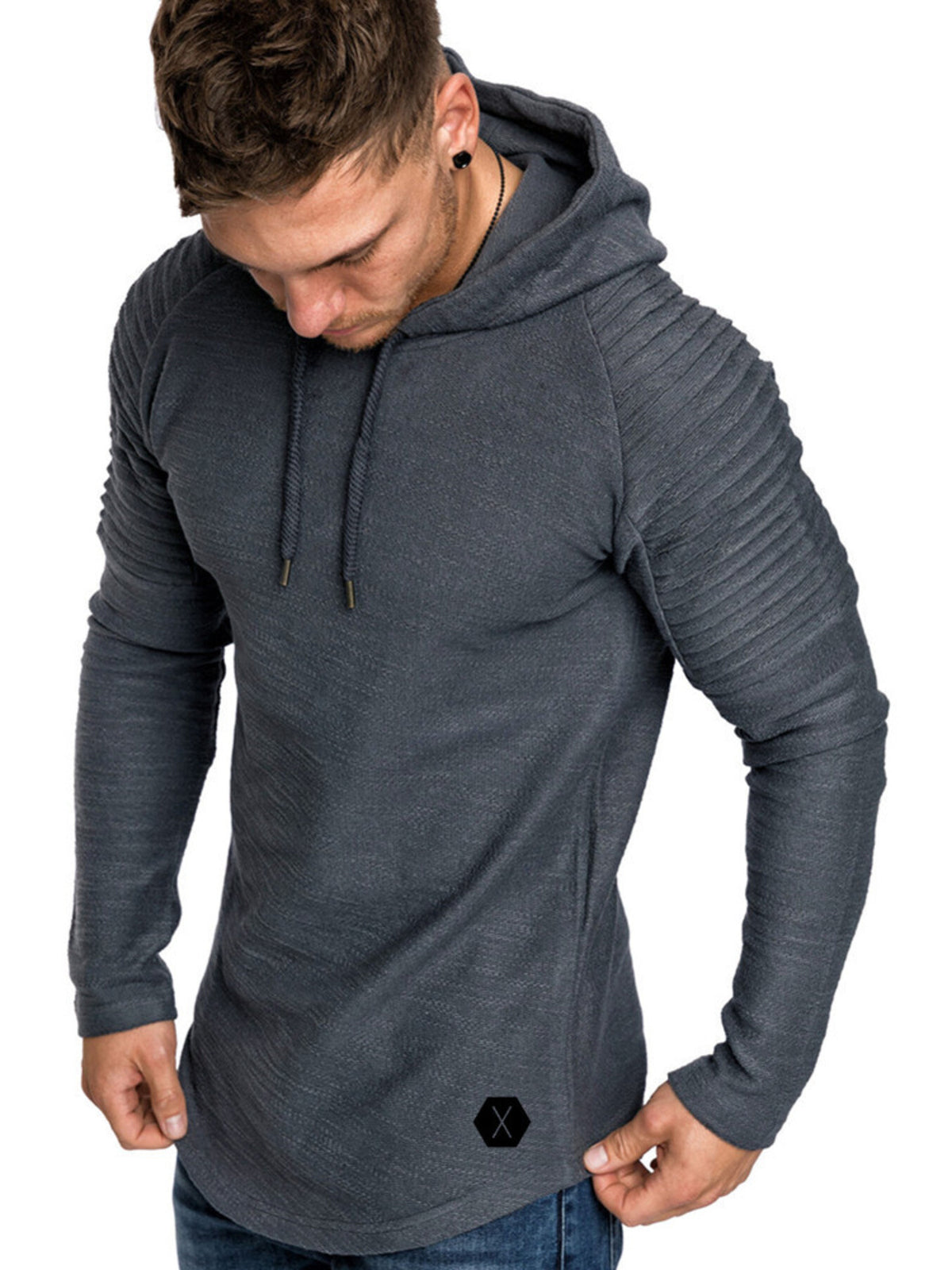 Man wearing a charcoal-gray hooded pullover with ribbed shoulder panels and drawstrings.