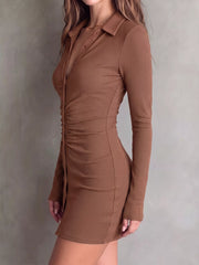 Side view of brown button-front dress with close-fitting silhouette.
