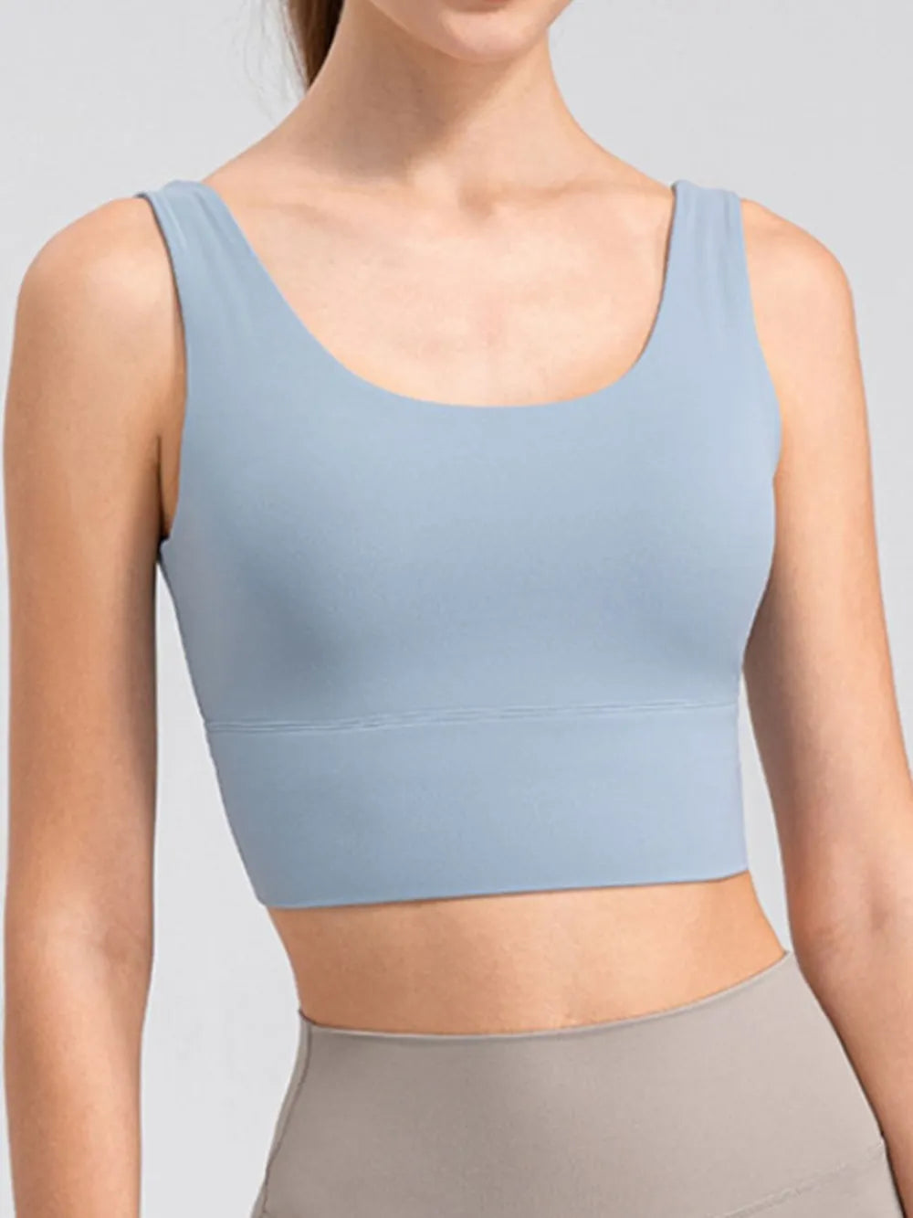 Light blue wide-strap cropped tank with scoop neckline, front view