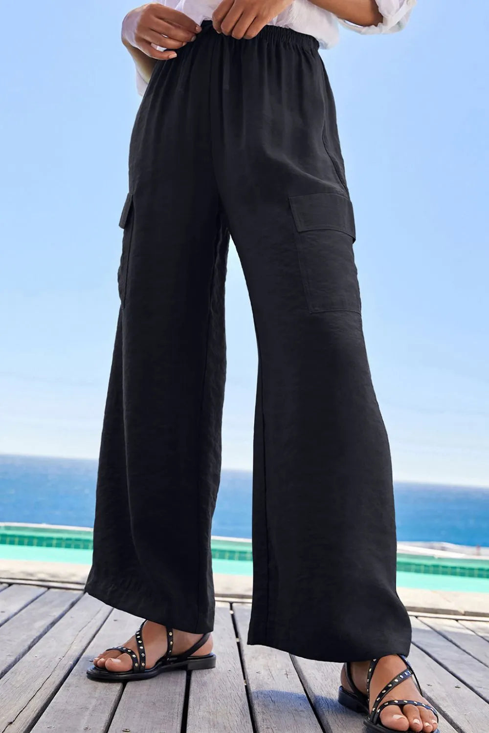 Black wide-leg utility trousers shown from the front