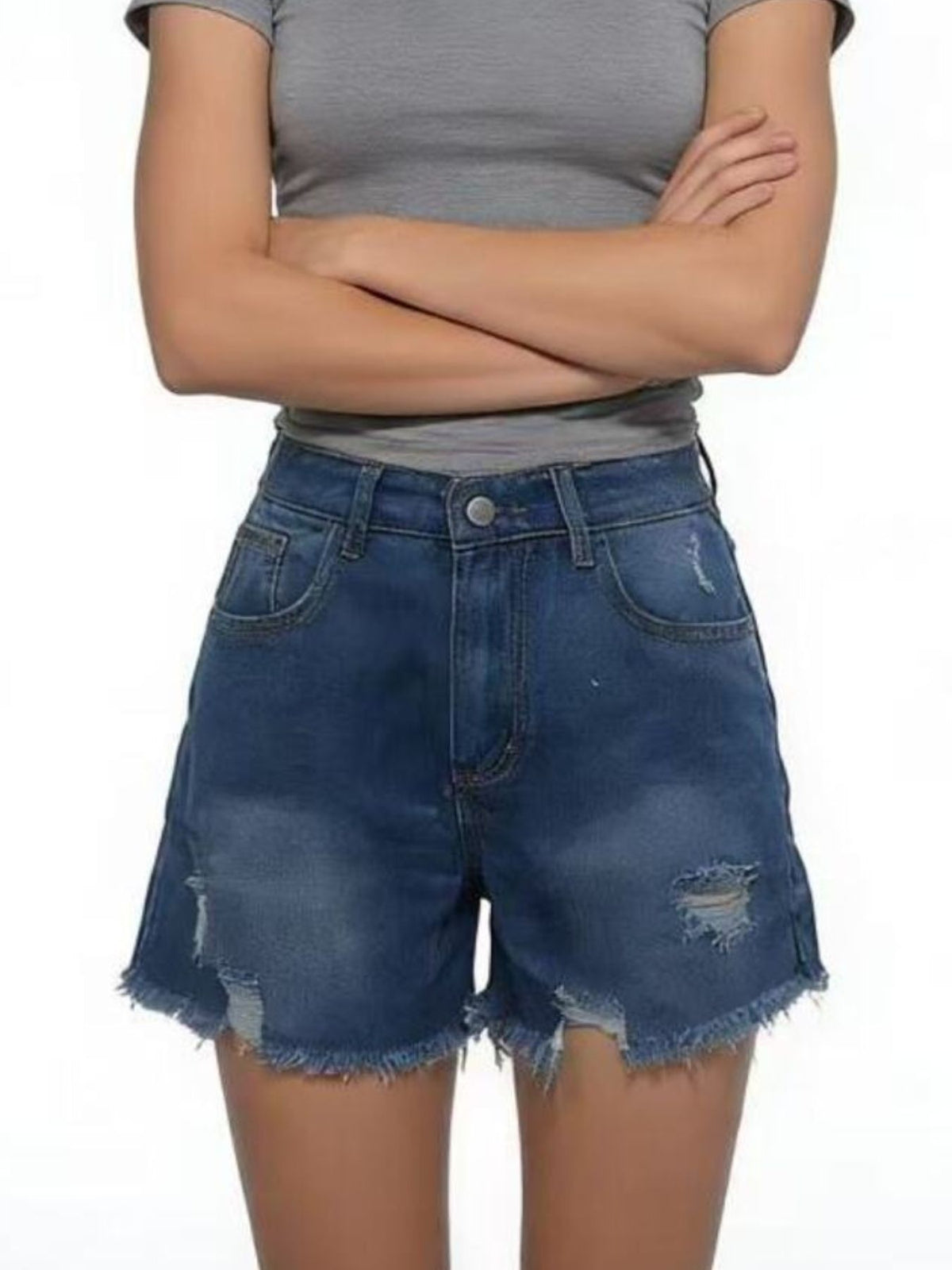 Blue distressed denim shorts with belt loops and frayed hems, worn with a grey crop top