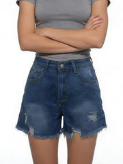 Blue distressed denim shorts with belt loops and frayed hems, worn with a grey crop top