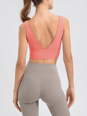 Back view of the pink tank showing its deep V-back