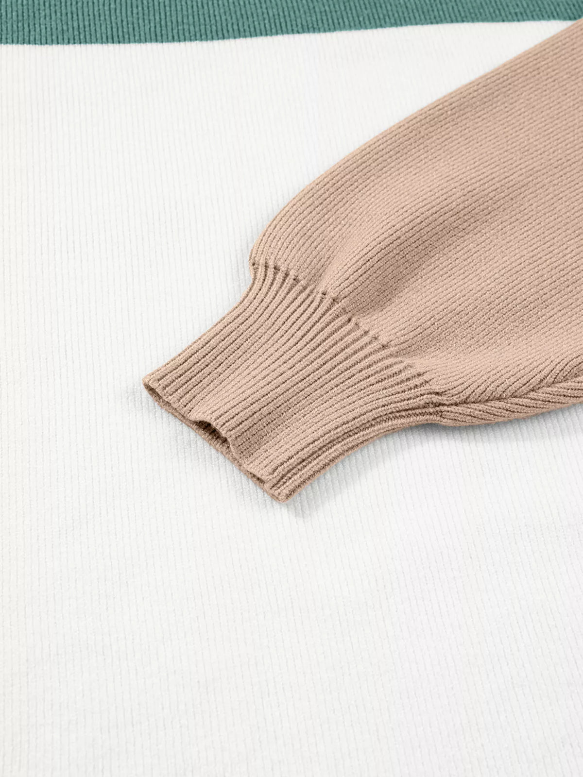 Close-up of taupe ribbed sleeve cuff