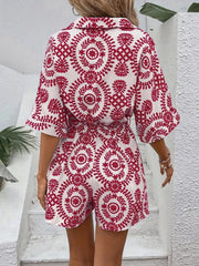 Women's printed tie-waist button-front romper, close-up of red print