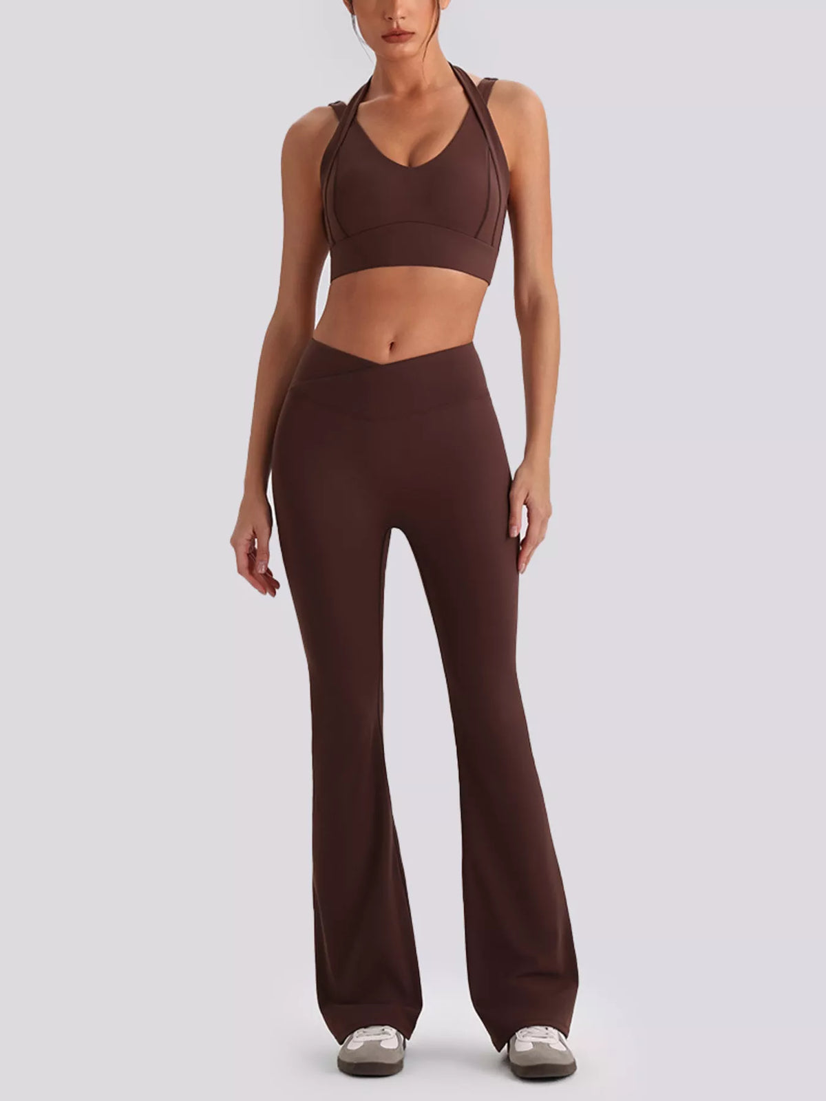 Back view showing fit of seamless criss-cross v-neck tank and leggings active set