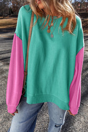 Front view of turquoise and pink sweatshirt