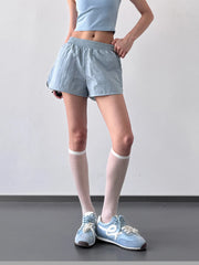Garment detail view of elastic waist active shorts