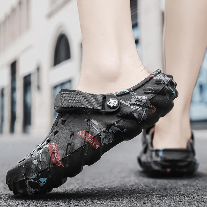 Black printed clog with ventilation holes and instep strap, worn from the side