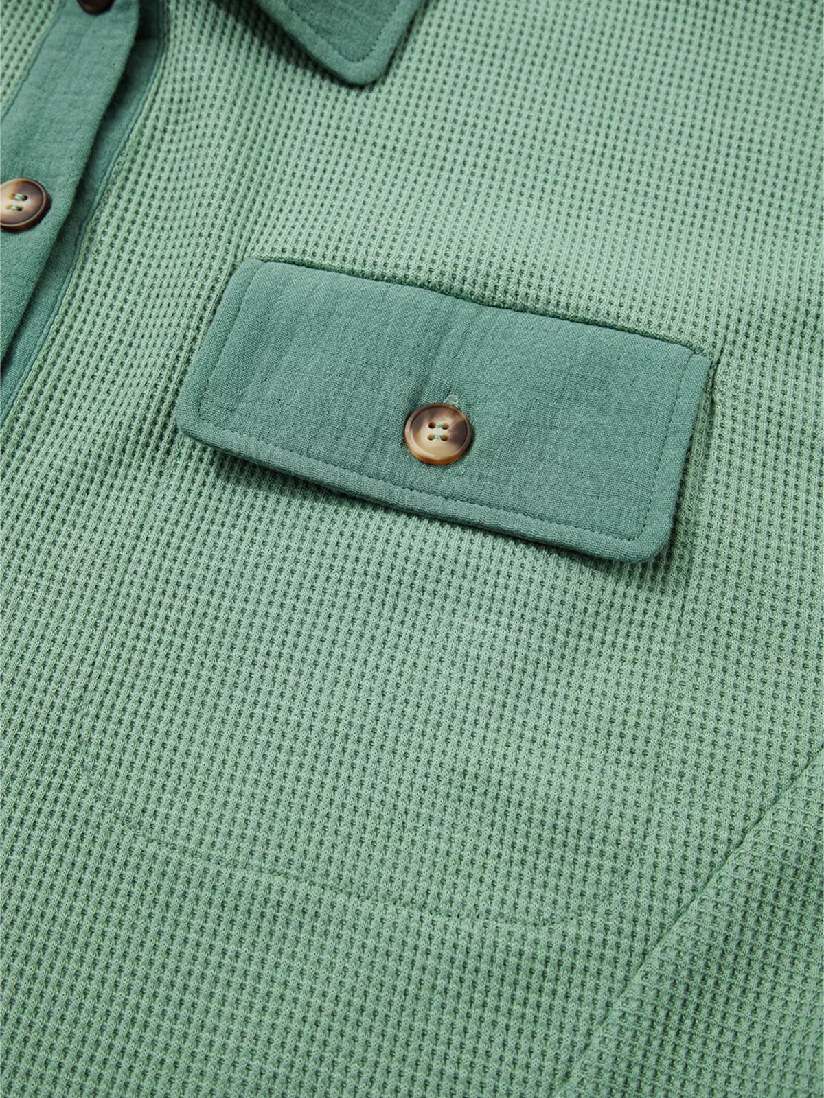 Buttoned flap chest pocket on sage waffle-knit shirt