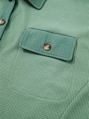Buttoned flap chest pocket on sage waffle-knit shirt