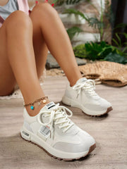White sneakers worn with shorts, side view