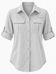 Front view of light gray button-down shirt with rolled sleeves