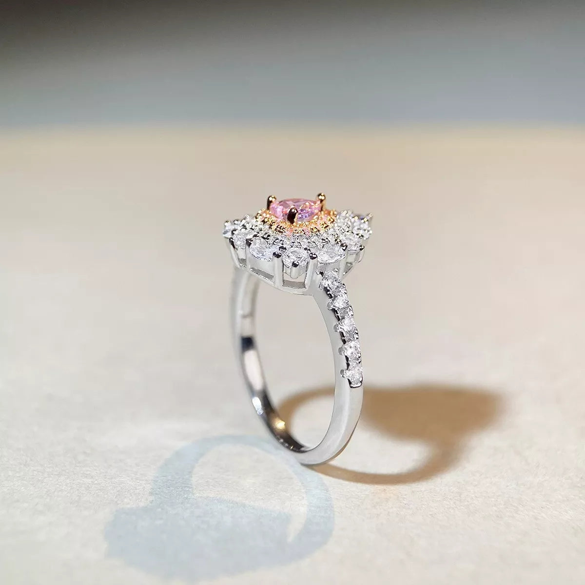 Angled view of the raised heart-shaped center and embellished ring band.