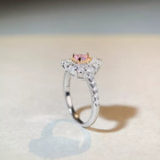 Angled view of the raised heart-shaped center and embellished ring band.