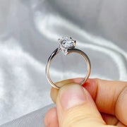 Moissanite ring worn on a finger
