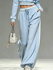 Light blue matching set detail showing drawstring waist and roomy pants pockets