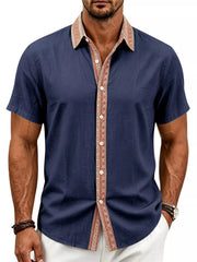 Model wearing navy shirt with patterned collar and placket