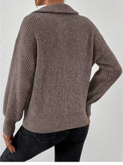 Back view of taupe ribbed sweater with dropped shoulder seams and straight hem