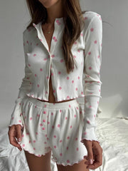 Model wearing cropped floral ribbed cardigan and matching lounge shorts