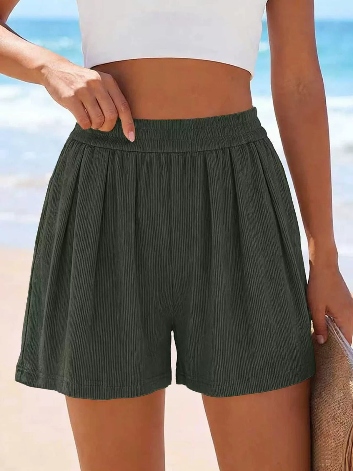 Dark green high-waisted shorts shown from the front