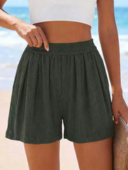 Dark green high-waisted shorts shown from the front