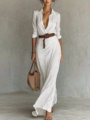 Front view of the white long-sleeve button-front shirt maxi dress with a brown belt.