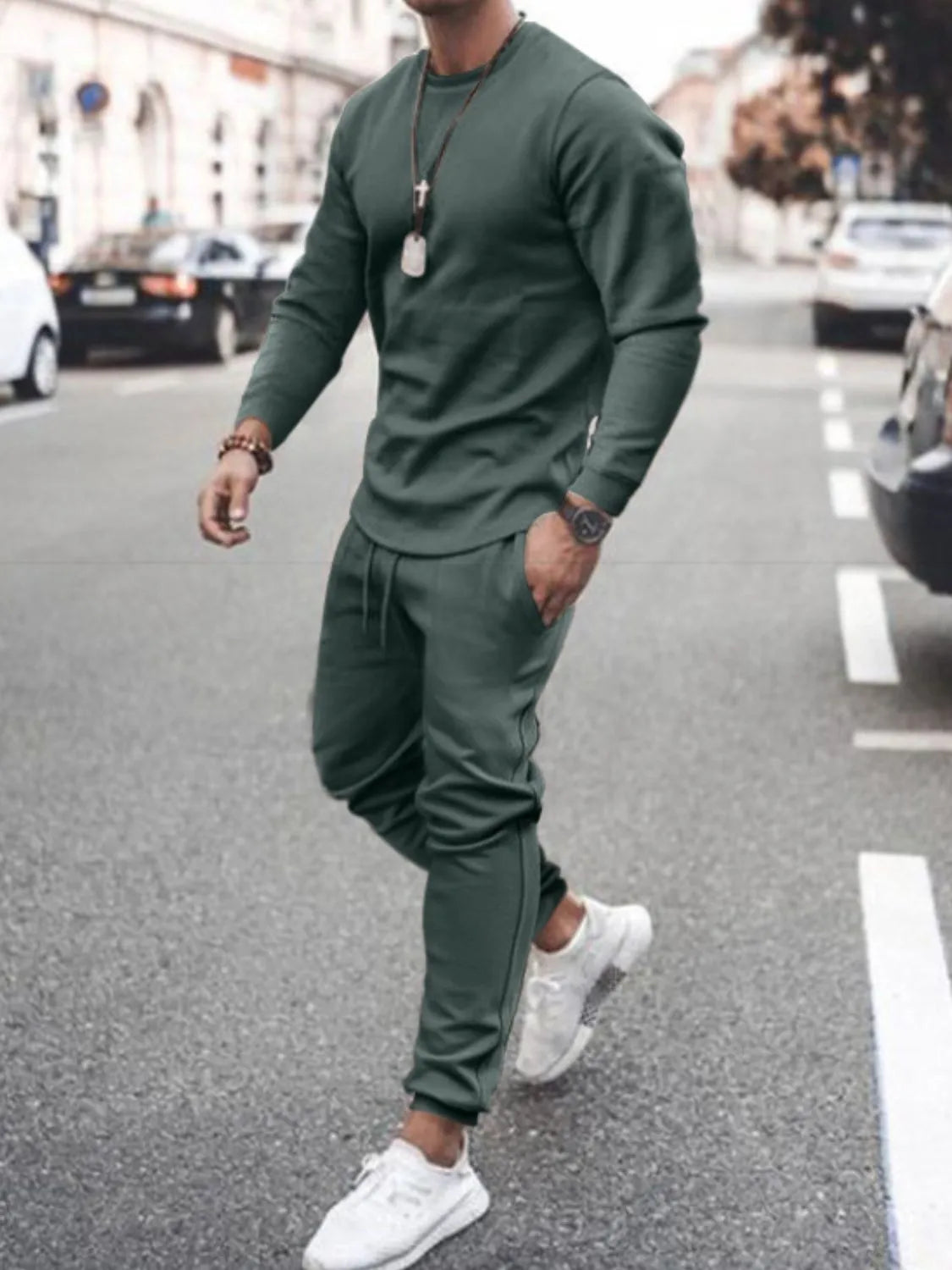Model wearing dark green long-sleeve top and jogger pants set