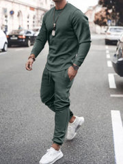 Model wearing dark green long-sleeve top and jogger pants set