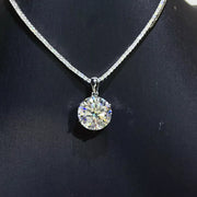 Round brilliant moissanite pendant necklace displayed against a dark background