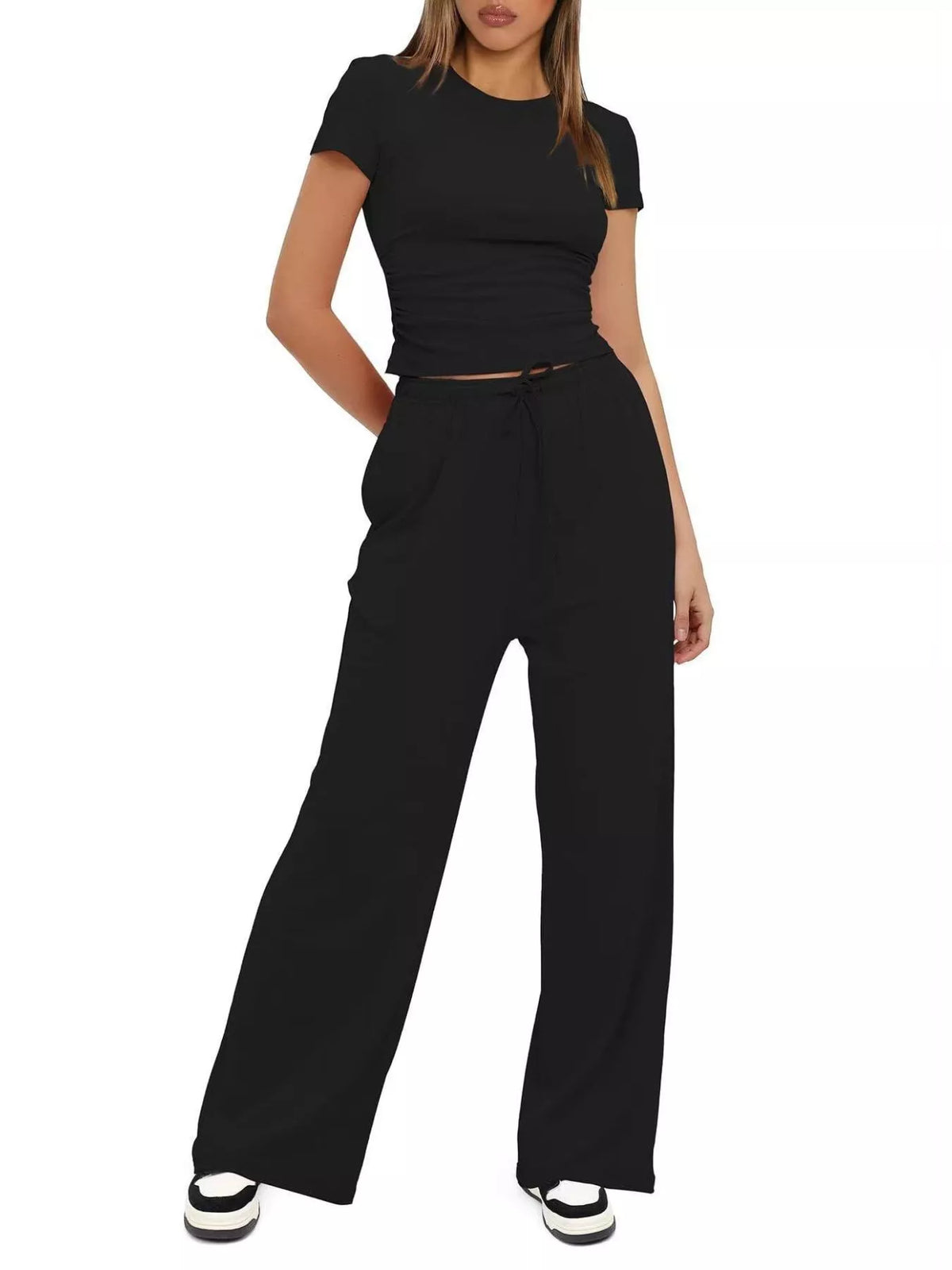 Front view of the black tank and wide-leg pants set.