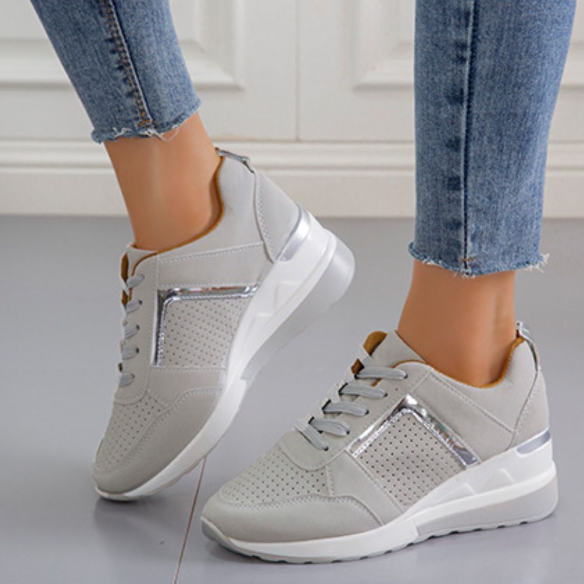 Gray wedge sneaker showing side panel and raised heel