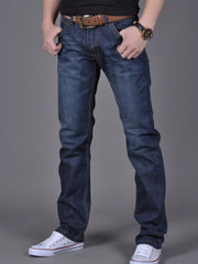 Dark blue slim-fit jeans modeled from the front