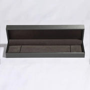 Empty presentation box shown beside bracelet listing