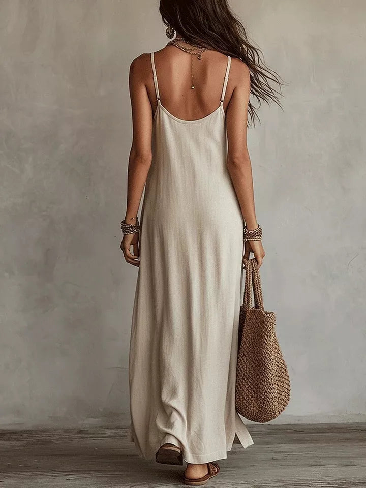 Back view of beige spaghetti-strap maxi dress on model