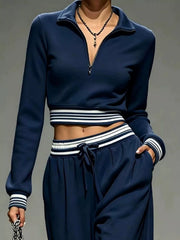 Navy matching pants showing loose wide legs, drawstring waist and side pockets