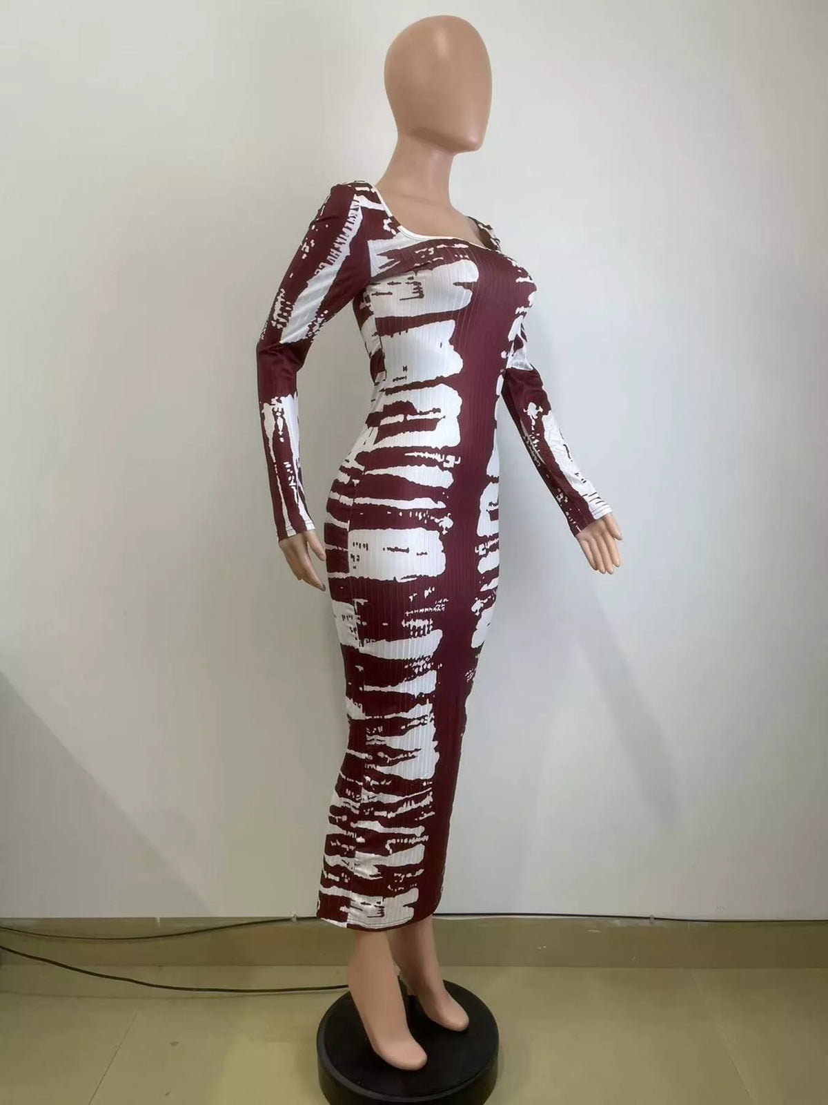 Angled mannequin view of wine red and white fitted tie-dye maxi dress