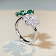Side view of the two flower settings raised above the ring band