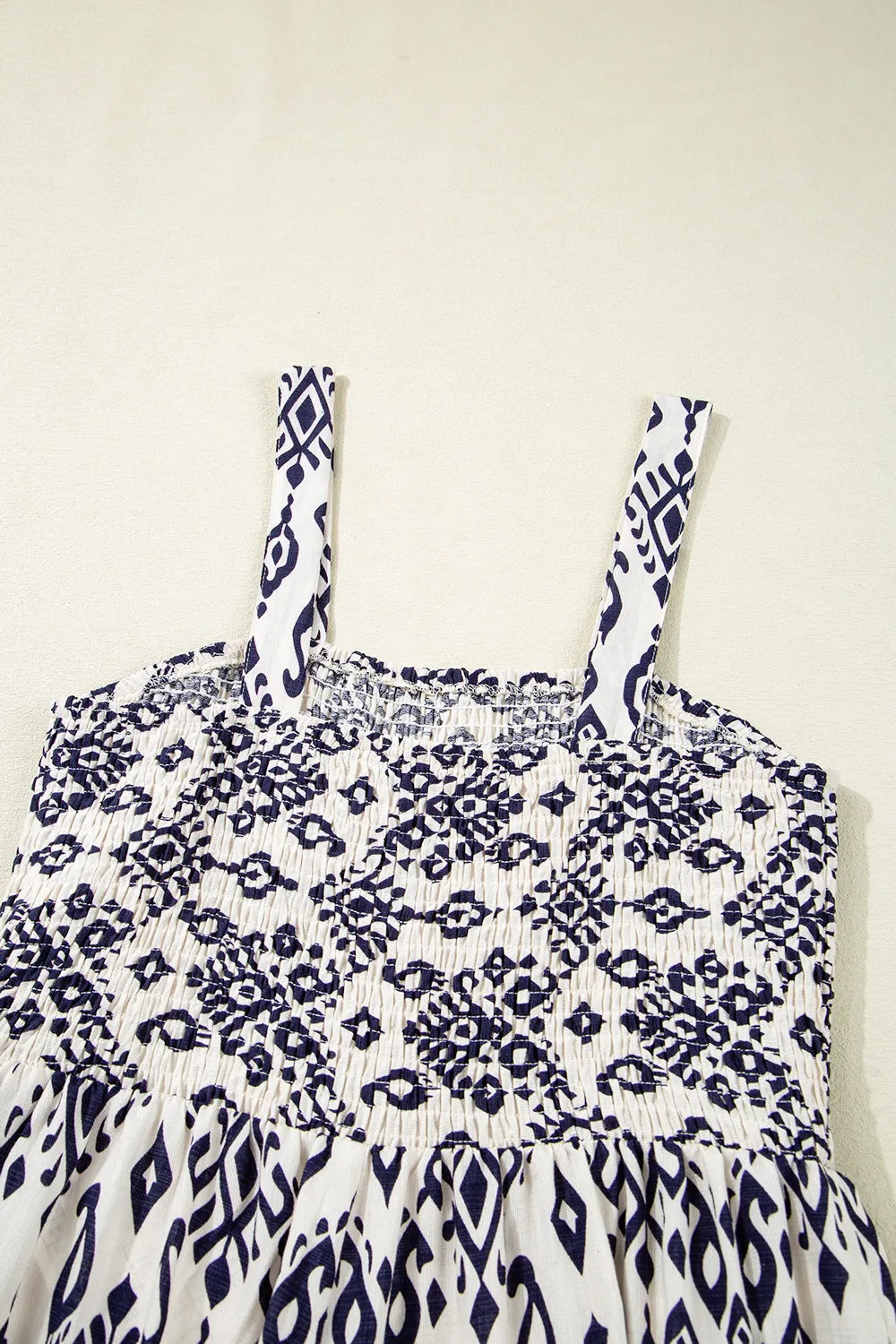 Close view of smocked bodice and straps